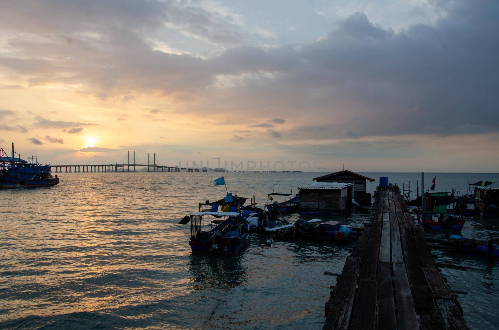 Georgetown, Penang/Malaysia - Mar 28 2018: Batu Maung fishing jetty with background Penang Second Bridge.