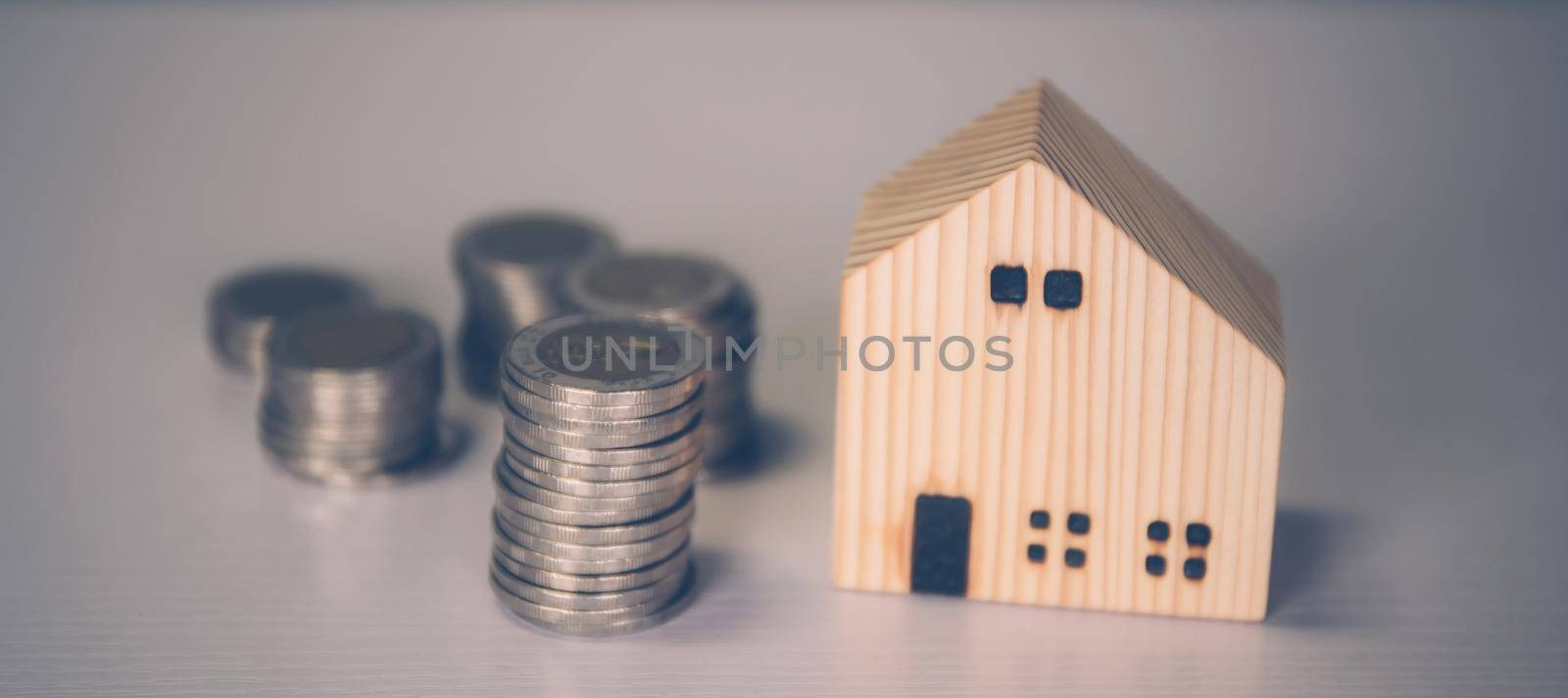 Stack of coin with revenue and saving money for real estate and success, finance and investment, insurance home, deposit and property and financial, residential and refinance, business concept.