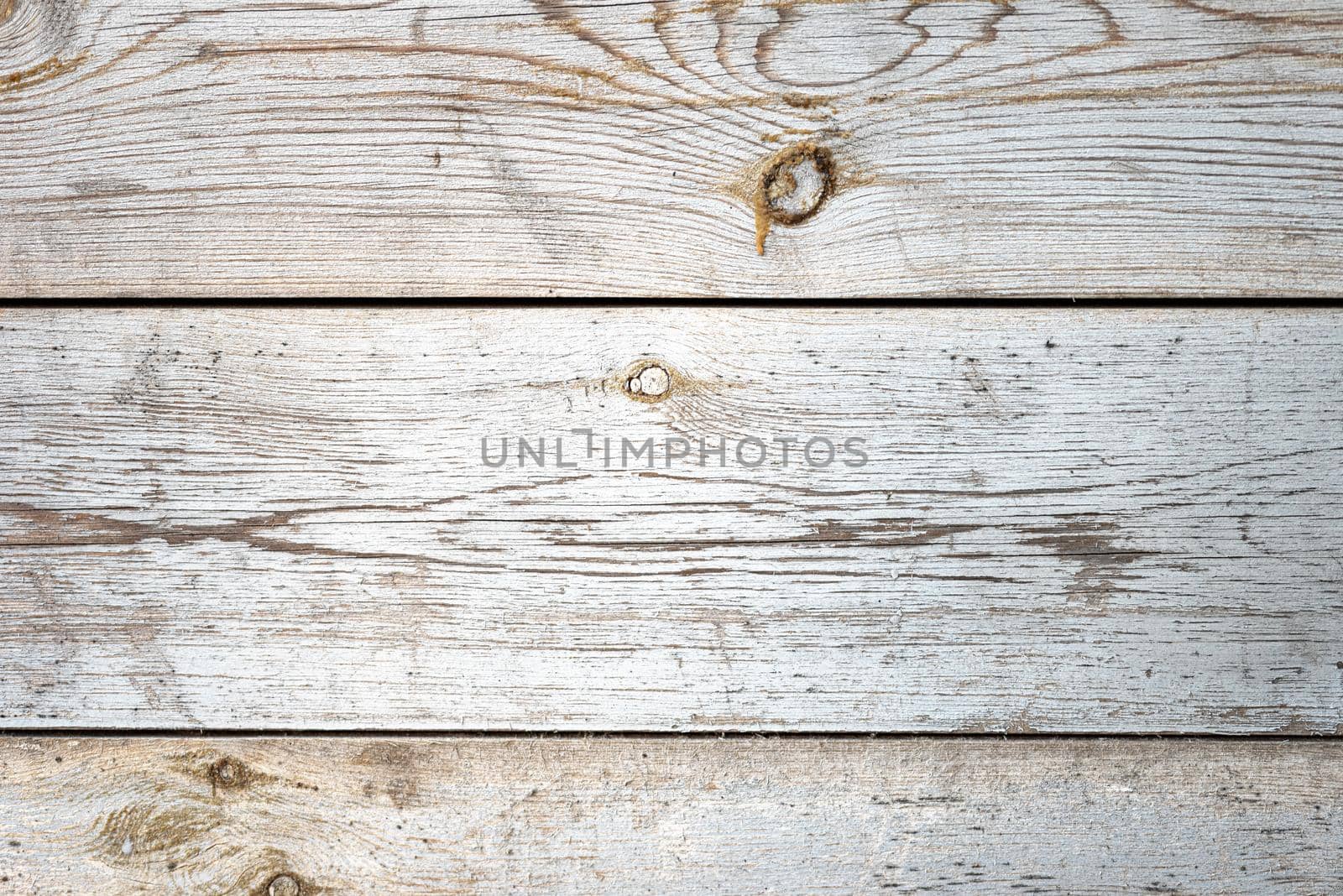 Old textures wooden peeled board with knots