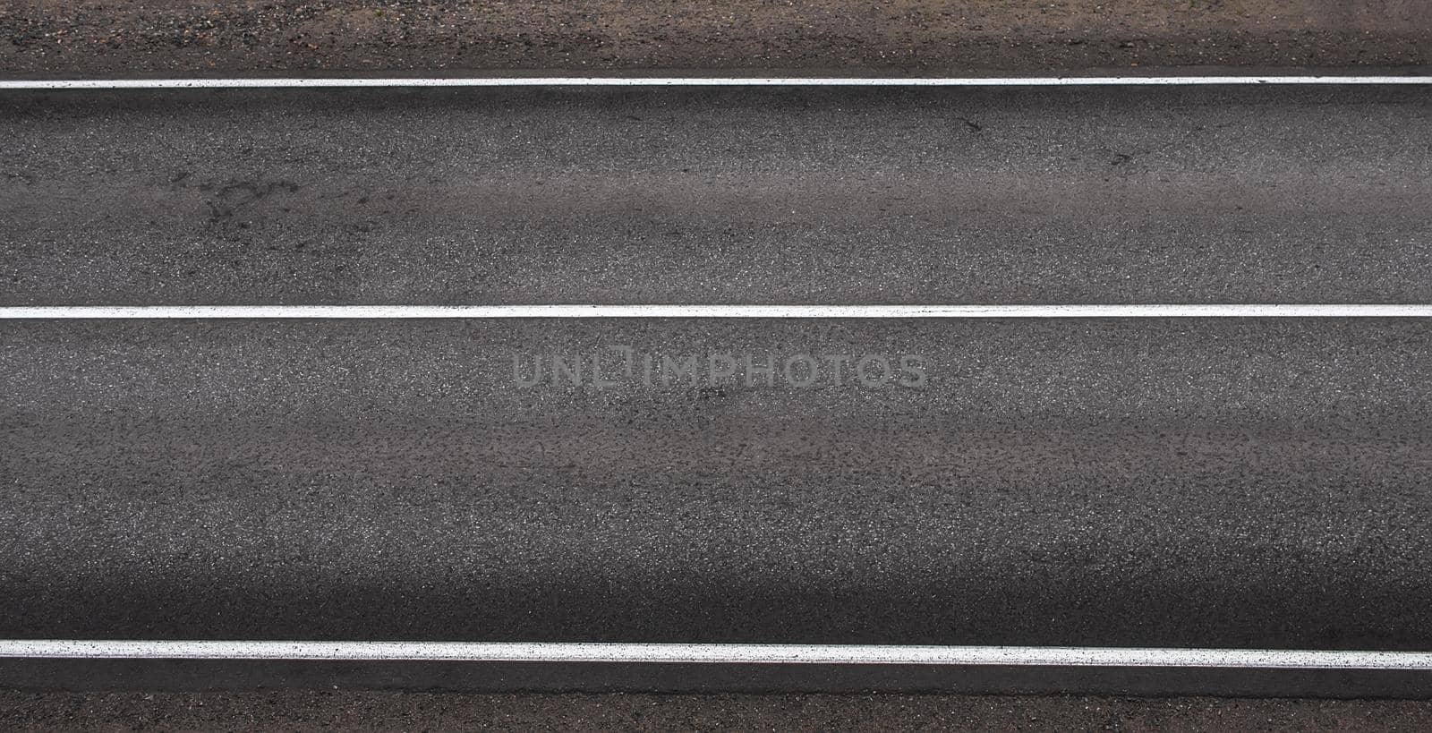 Asphalt highway texture with three white stripes by Estival