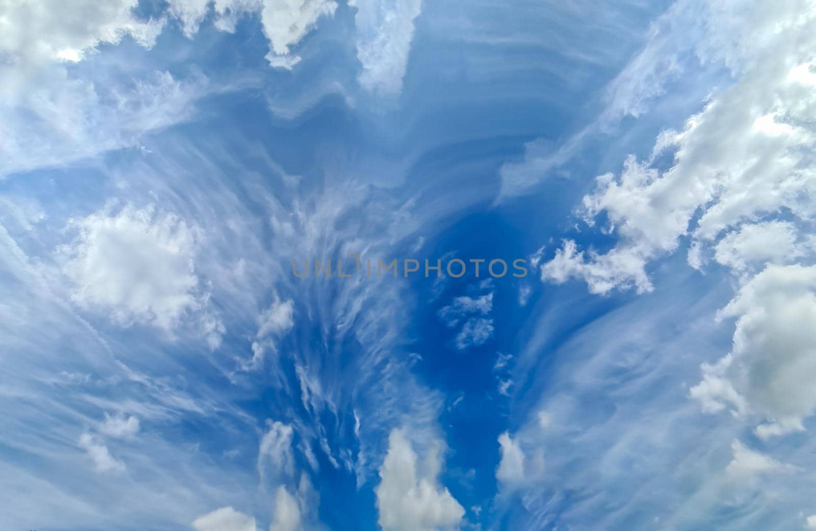 Stunning cirrus cloud formation panorama in a deep blue summer sky seen over Europe