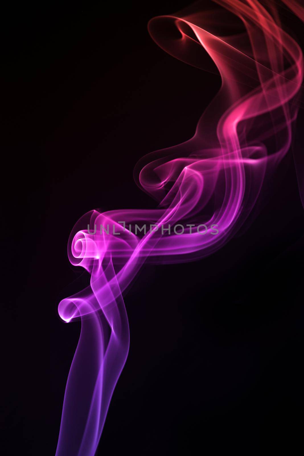 Blue with purple smoke isolated on black background. by thanumporn