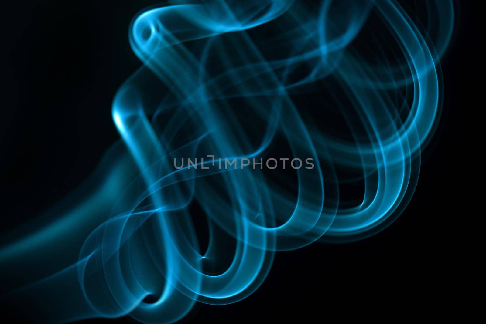 Blue smoke isolated on black background.