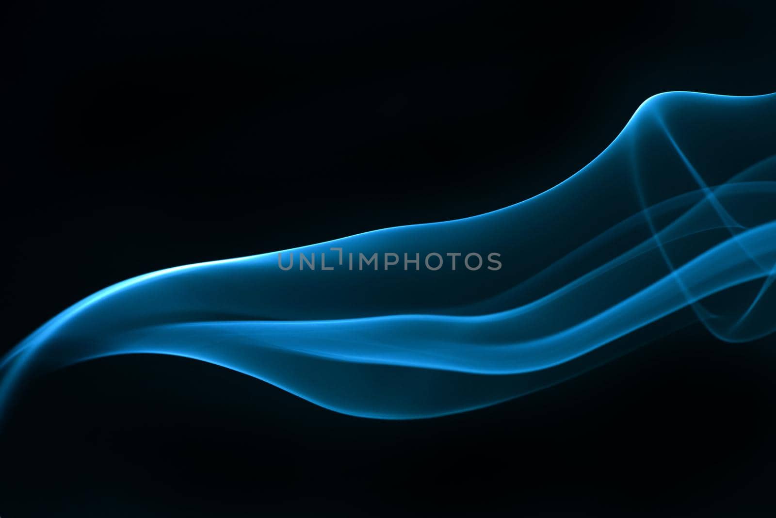 Blue smoke isolated on black background. by thanumporn