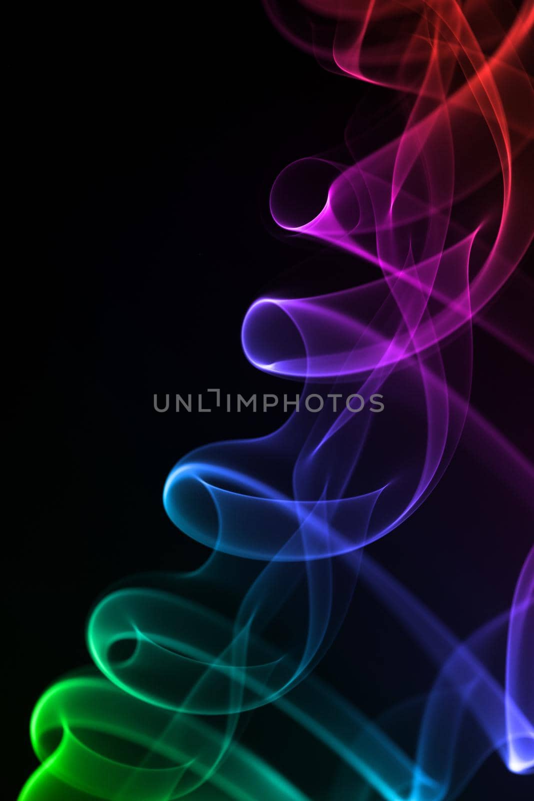 Colorful smoke isolated on black background.