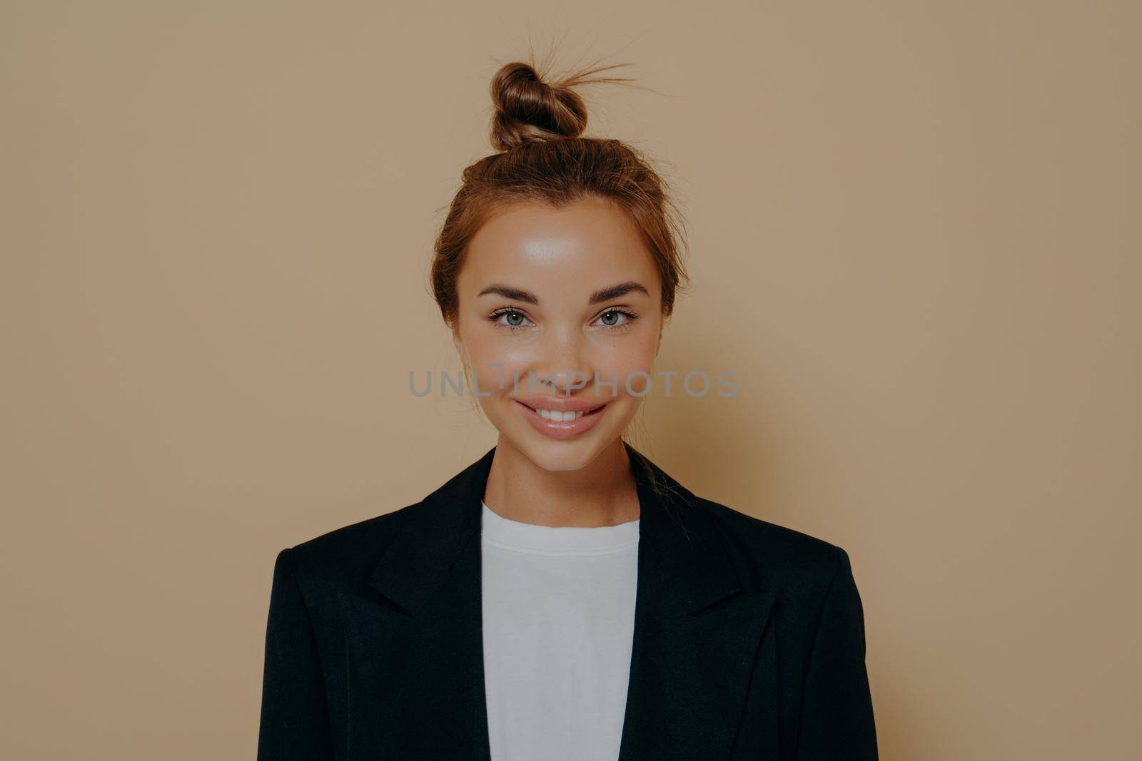 Young woman ready for business meeting on beige background by vkstock