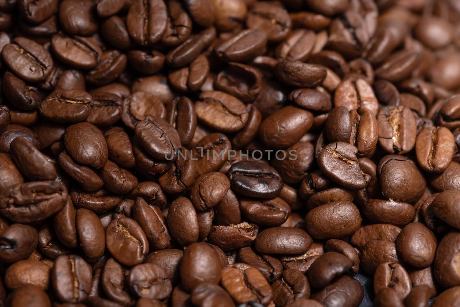 Fresh brown roasted coffee beans background