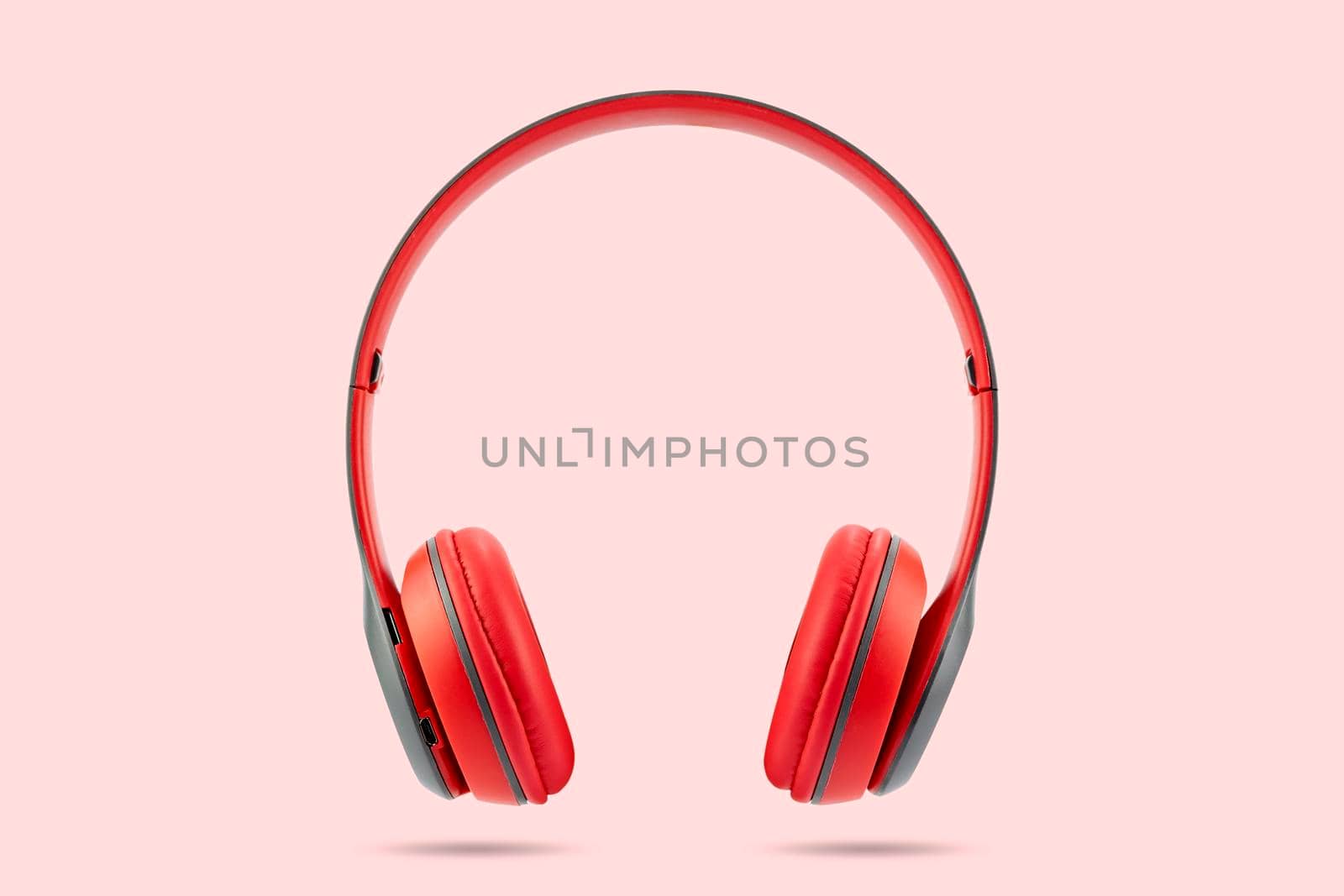 Modern design of red color wireless earphone isolated  by wattanaphob