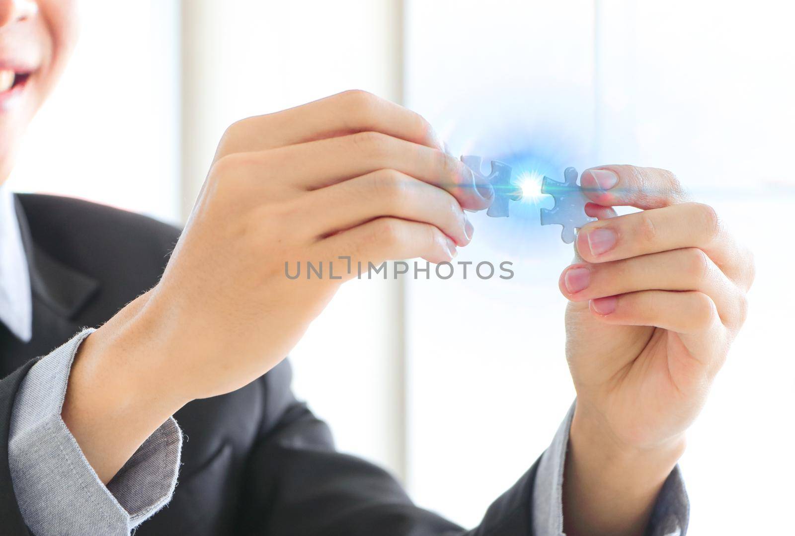 A close up of a businessman holding a piece of the puzzle Business problem-solving concept in office Brainstorming success concepts strategy