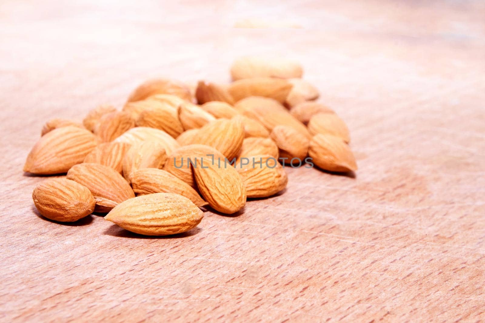 Ripe apricot kernels, taste of warm summer. A softer, usually edible part of a nut, seed, or fruit stone contained within its hard shellHigh quality photo