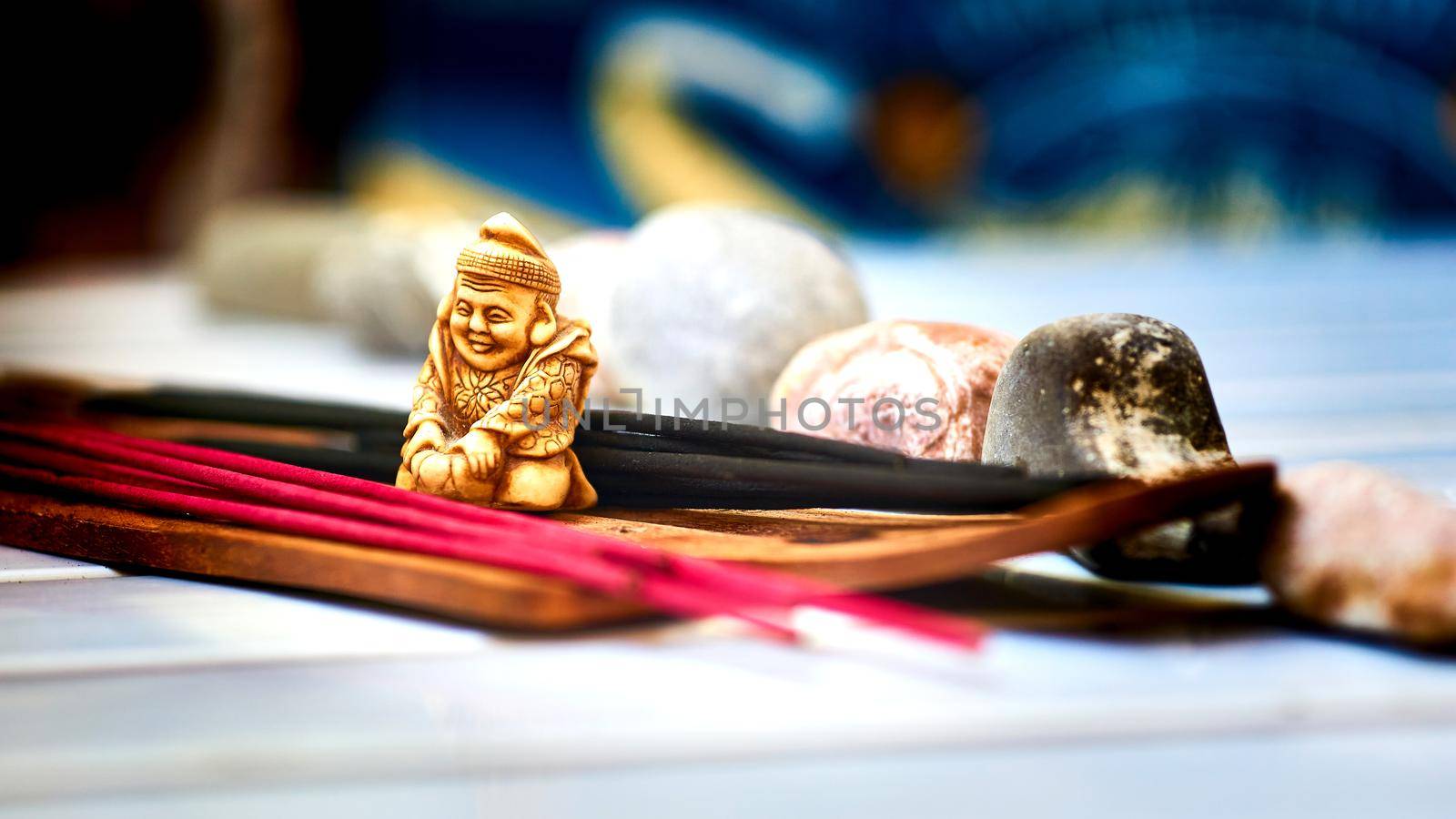 Quiet meditation with incense, stones and Buddha figurine by jovani68