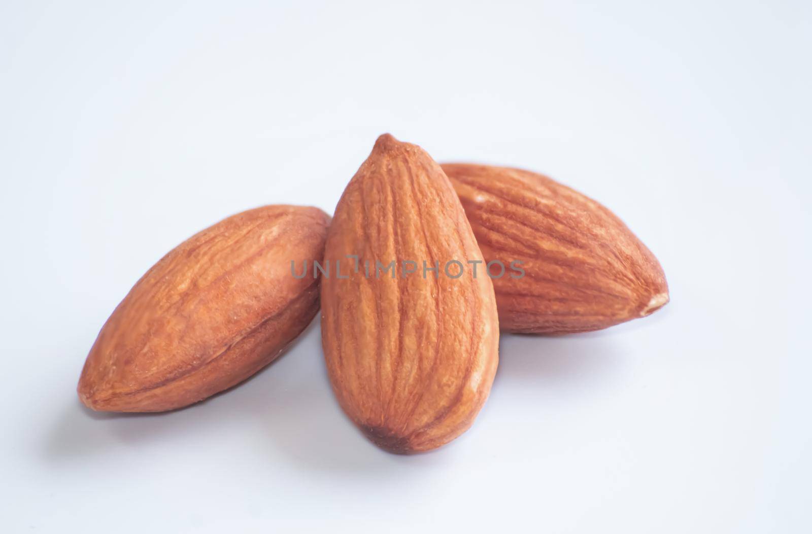 Almonds Delicious. Almonds isolated on white background.