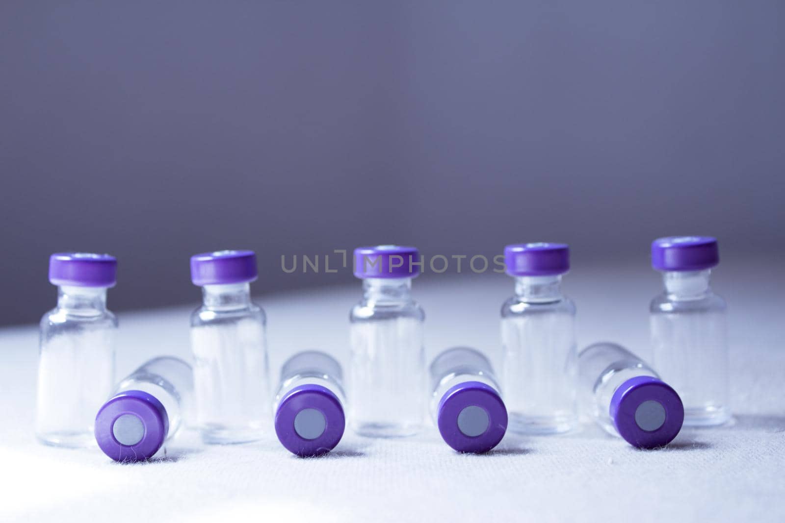Empty glass jars of coronavirus vaccines. No people