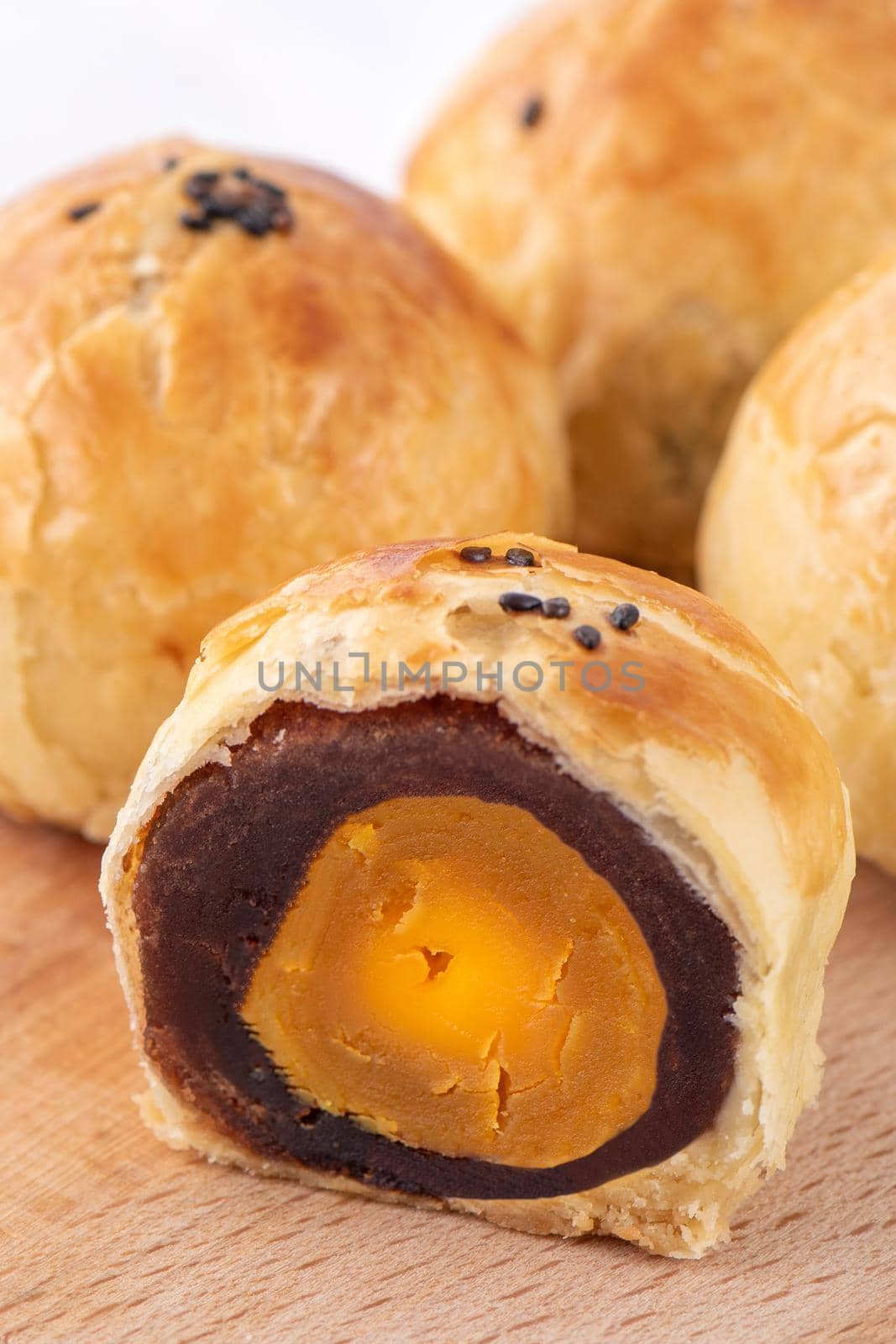Close up of Moon cake yolk pastry, mooncake for Mid-Autumn Festival holiday on wooden table background