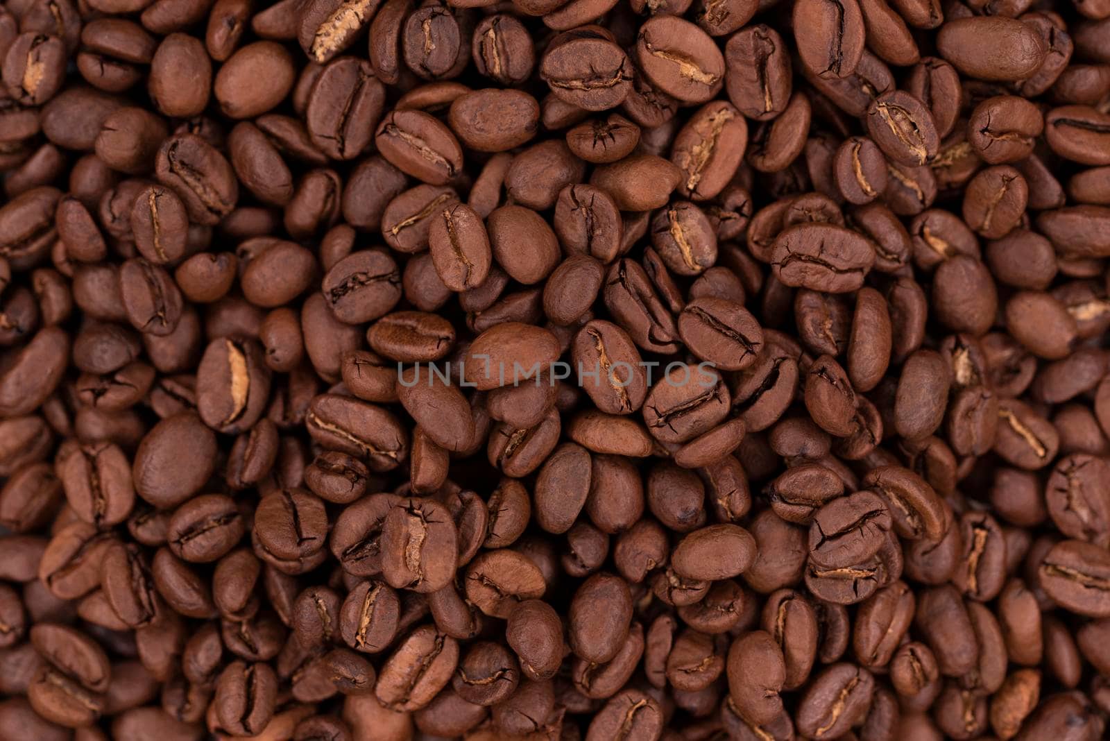 Fresh brown roasted coffee beans as a background by Estival