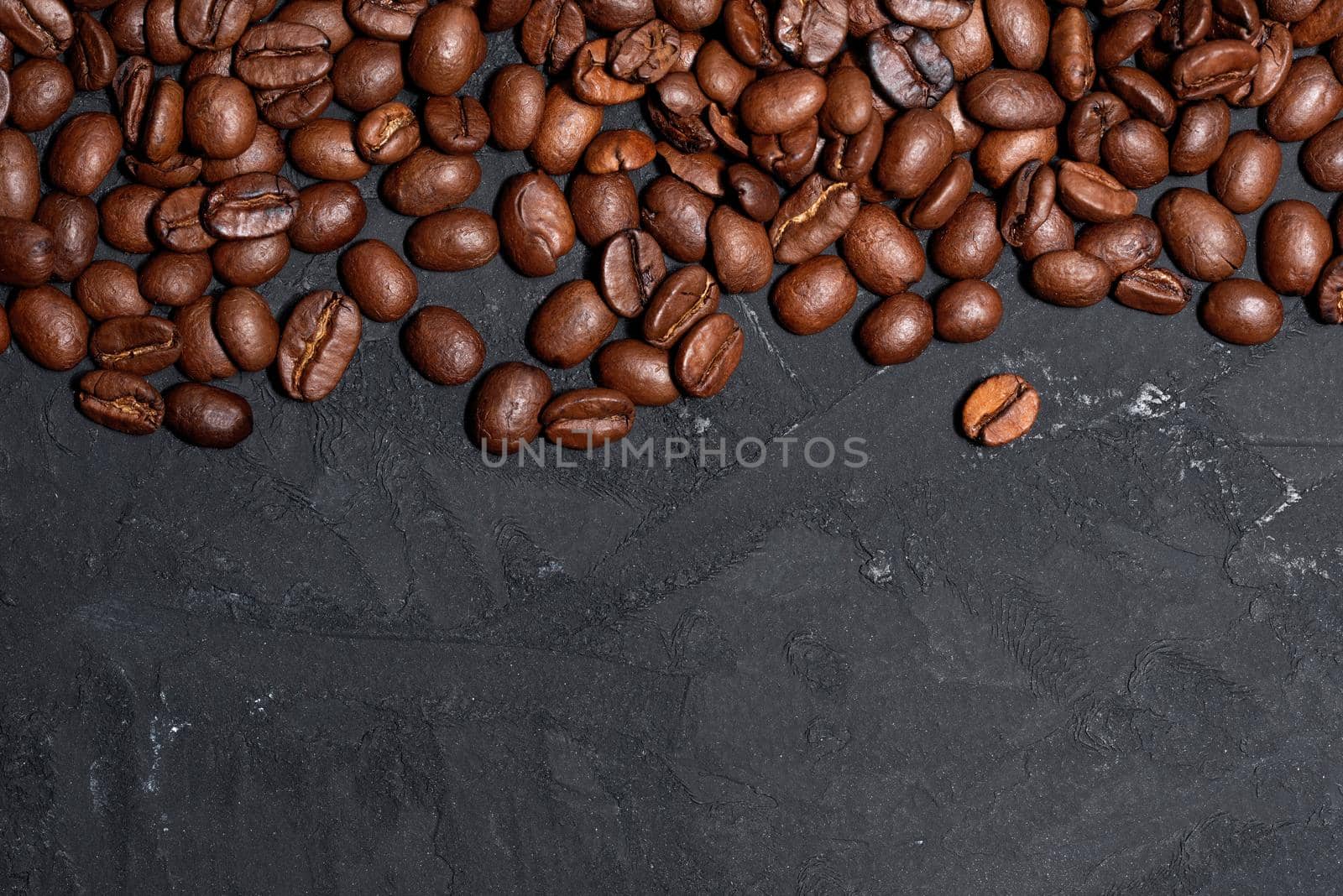 Fresh brown roasted coffee beans as a background by Estival