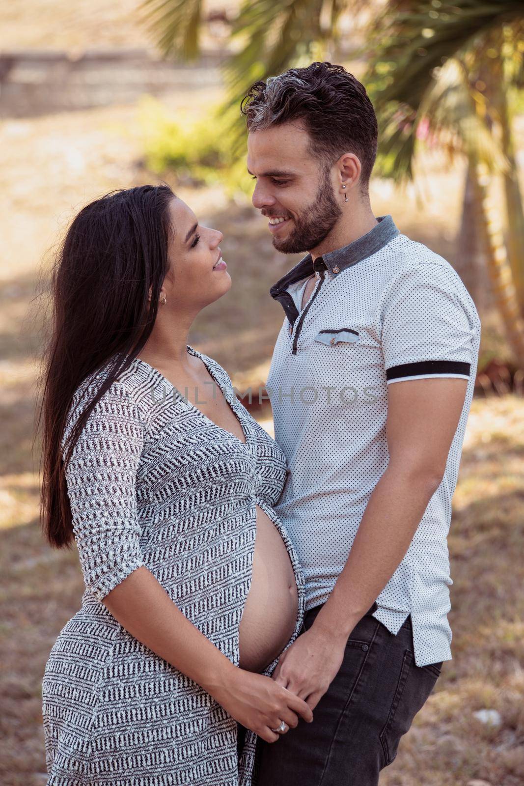 Photo of a young couple, the girl is pregnant