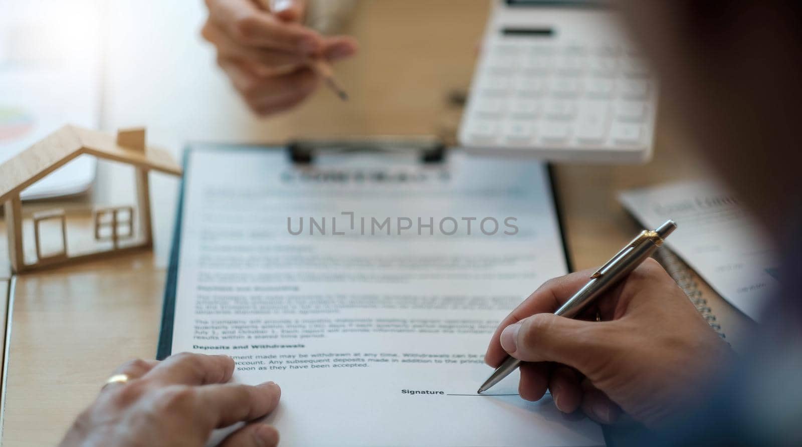 Close up man signing contract, job agreement, male client putting signature on legal documents, taking loan or mortgage, purchase real estate, insurance or investment deal.