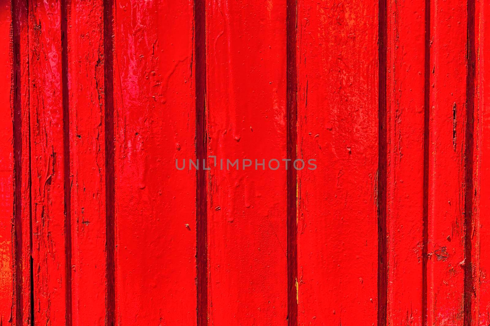 Red and black wooden wall with diferent color pattern.