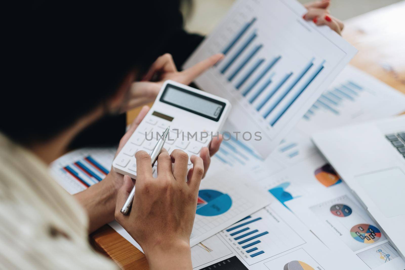 Financial, accounting with calculator, investment advisor consulting with team at office. Teamwork Meeting Concept