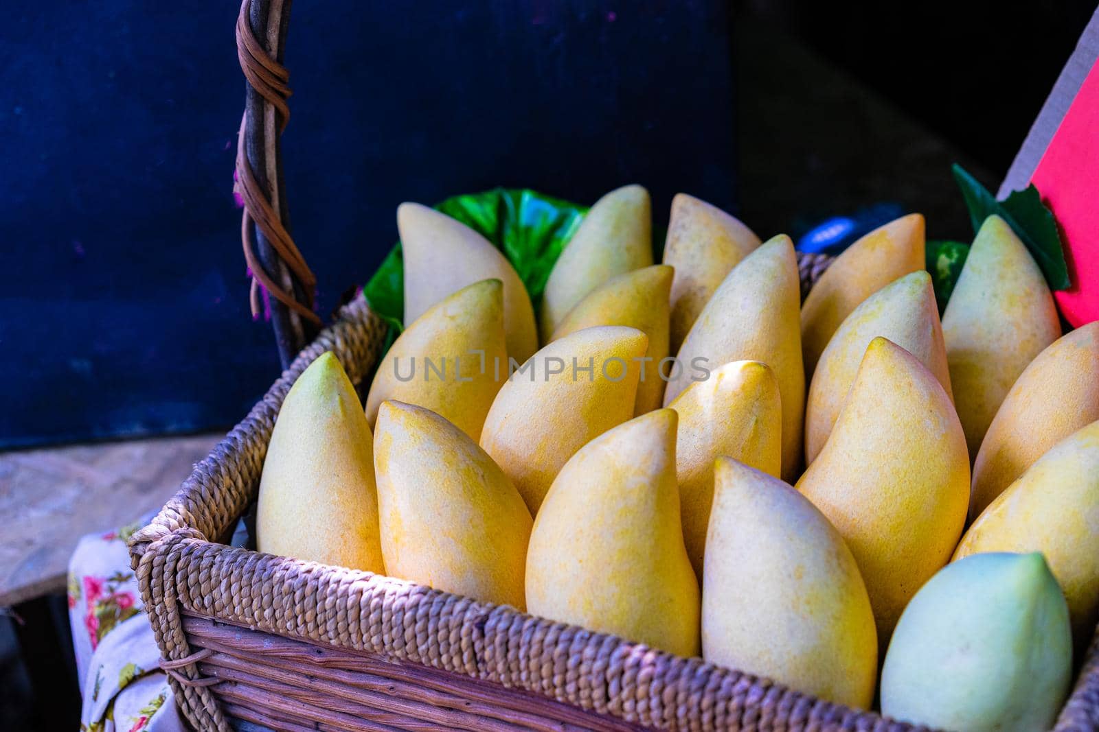 Yellow mango in basket selling at market in Thailand by domonite