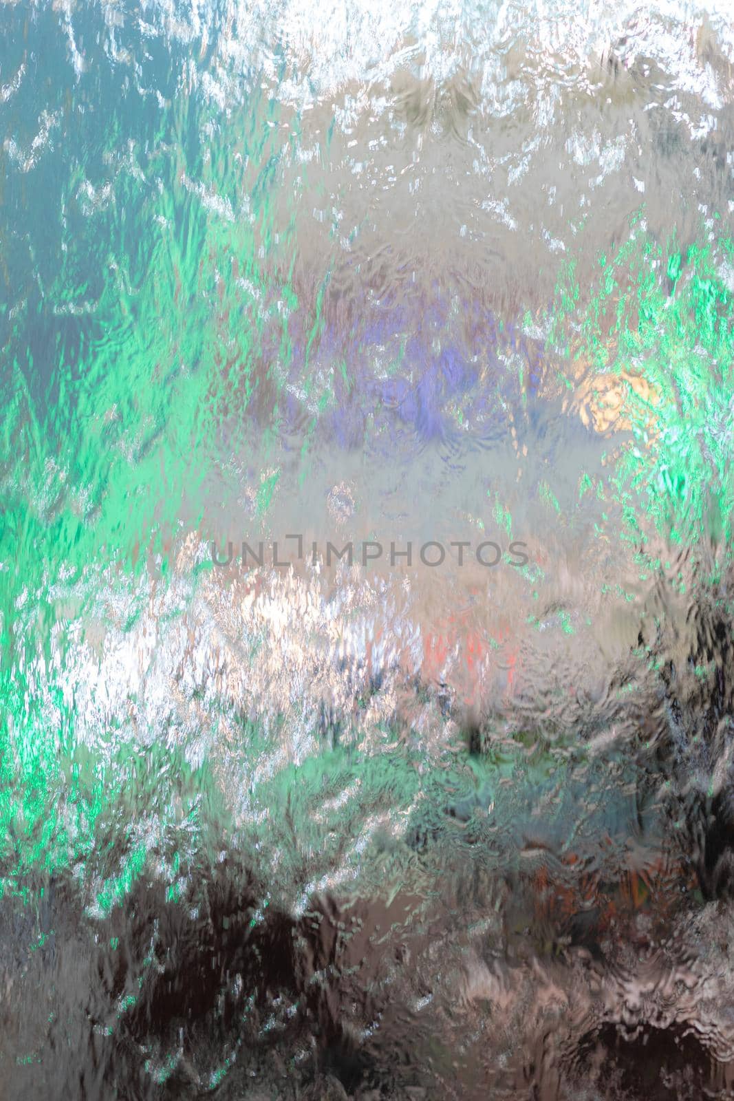 Water flows on the glass background by domonite