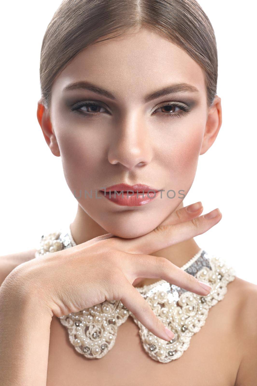 Looking classy. Vertical close up portrait of a gorgeous woman with flawless skin wearing professional makeup smiling to the camera confidently with a lacey decoration collar on her neck