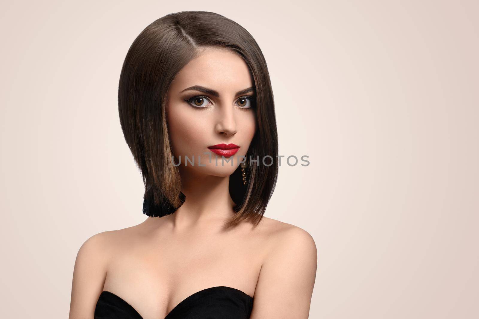 Perfect look. Fashion studio portrait of a beautiful elegant young woman with healthy shiny short hair looking to the camera copyspace beauty fashionable stylish feminine concept