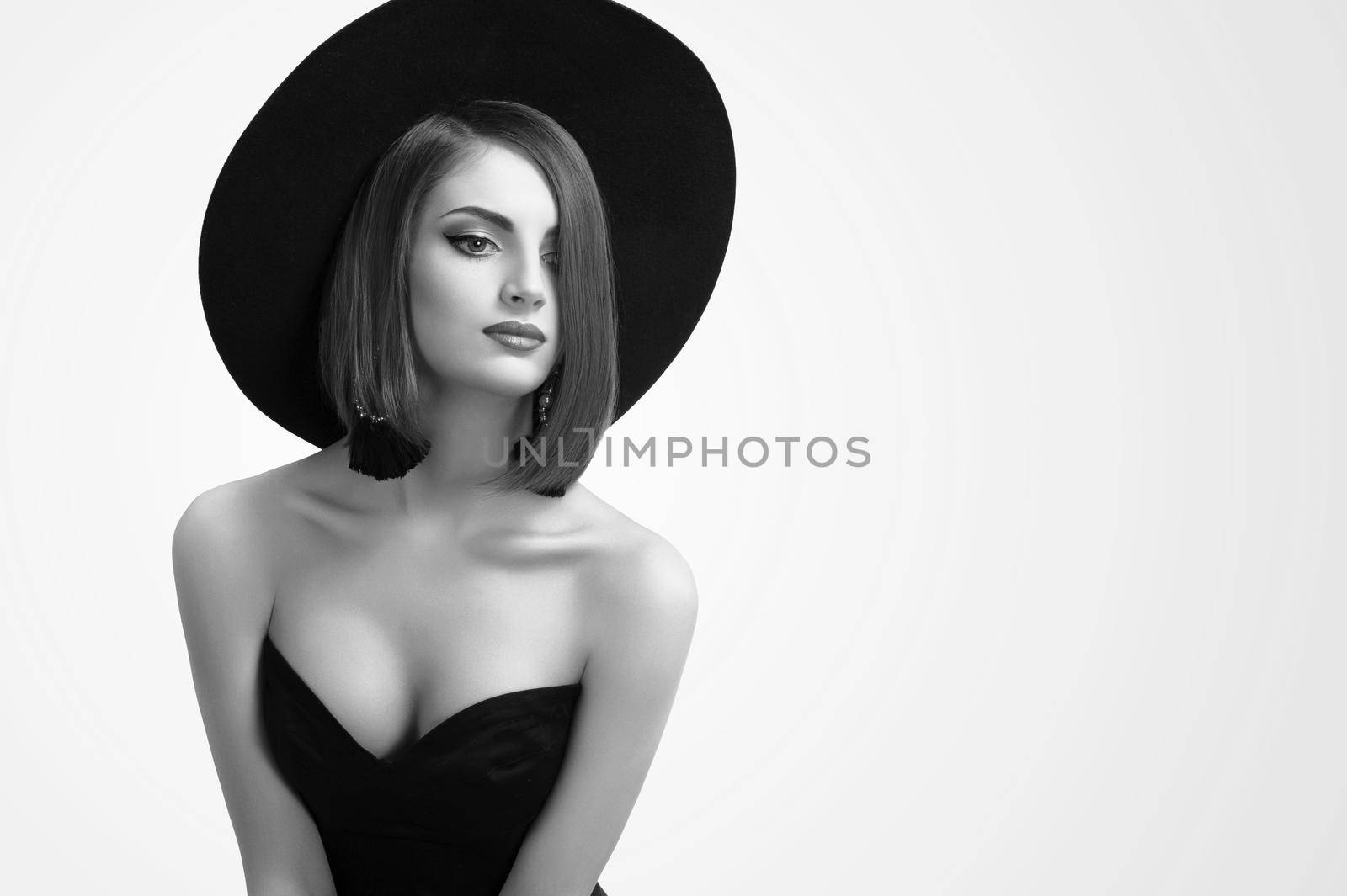 Monochrome beauty shots of an elegant woman in a hat by SerhiiBobyk