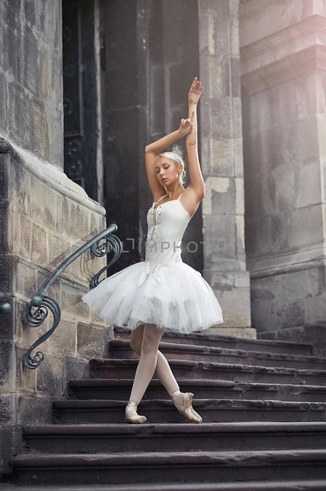 Beautiful ballerina dancing near an old building by SerhiiBobyk