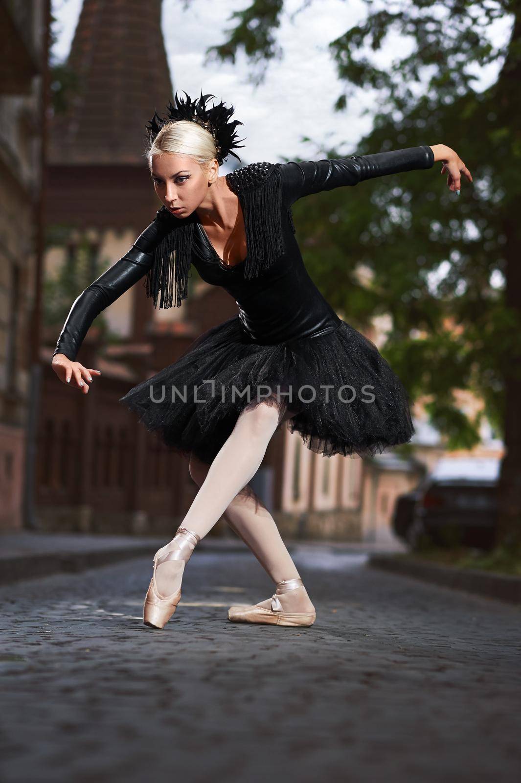 Shot of a beautiful professional female ballet dancer performing outdoors wearing black dancing outfit elegance grace sensuality concept.