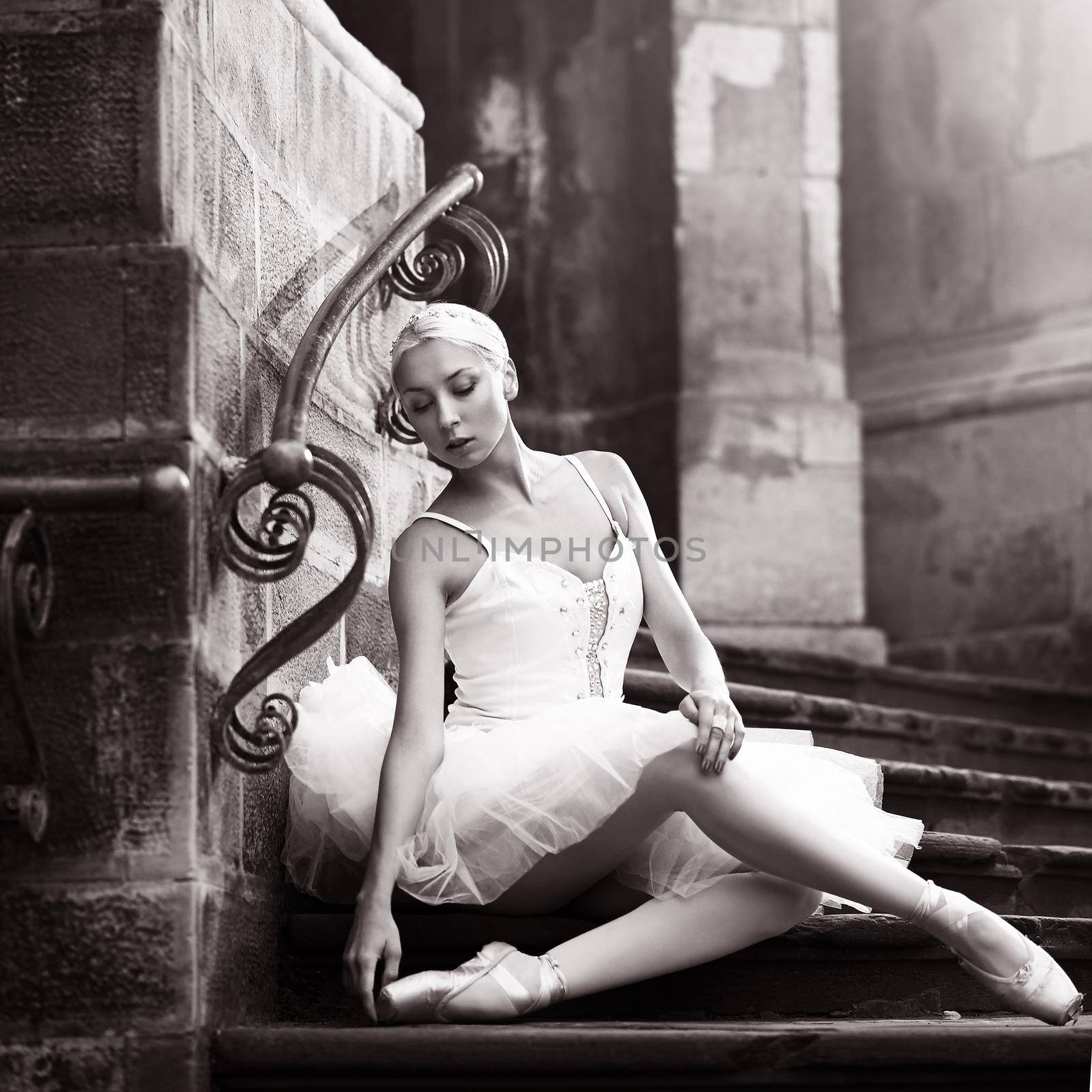 Young ballerina woman posing on stairs by SerhiiBobyk