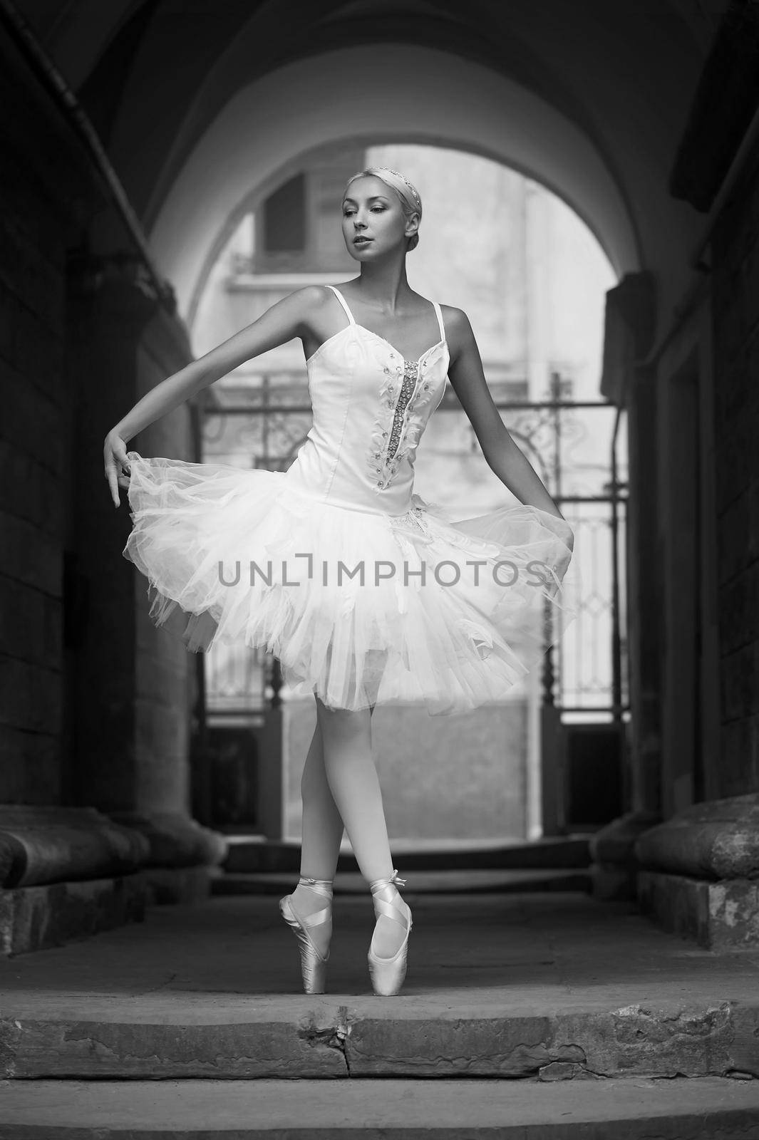 Ready for the big stage. Monochrome soft focus portrait of a young gorgeous ballerina performing her dance outdoors