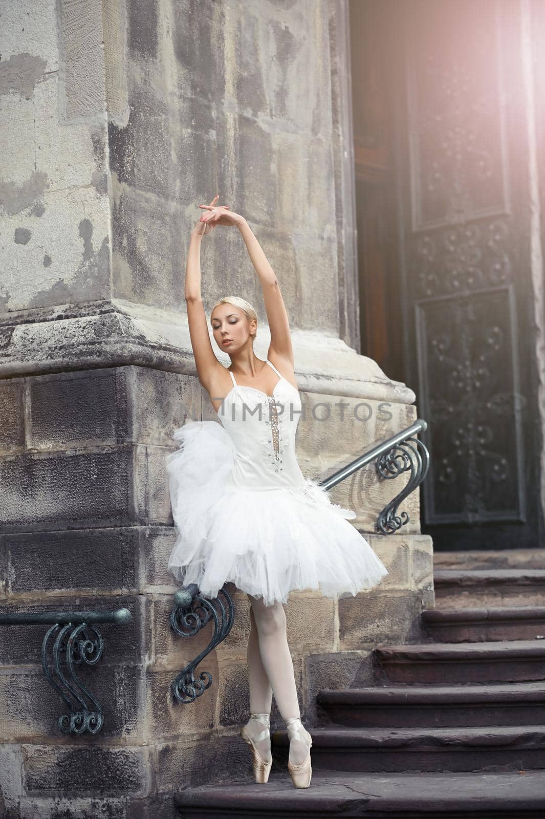 Beautiful ballerina dancing near an old building by SerhiiBobyk