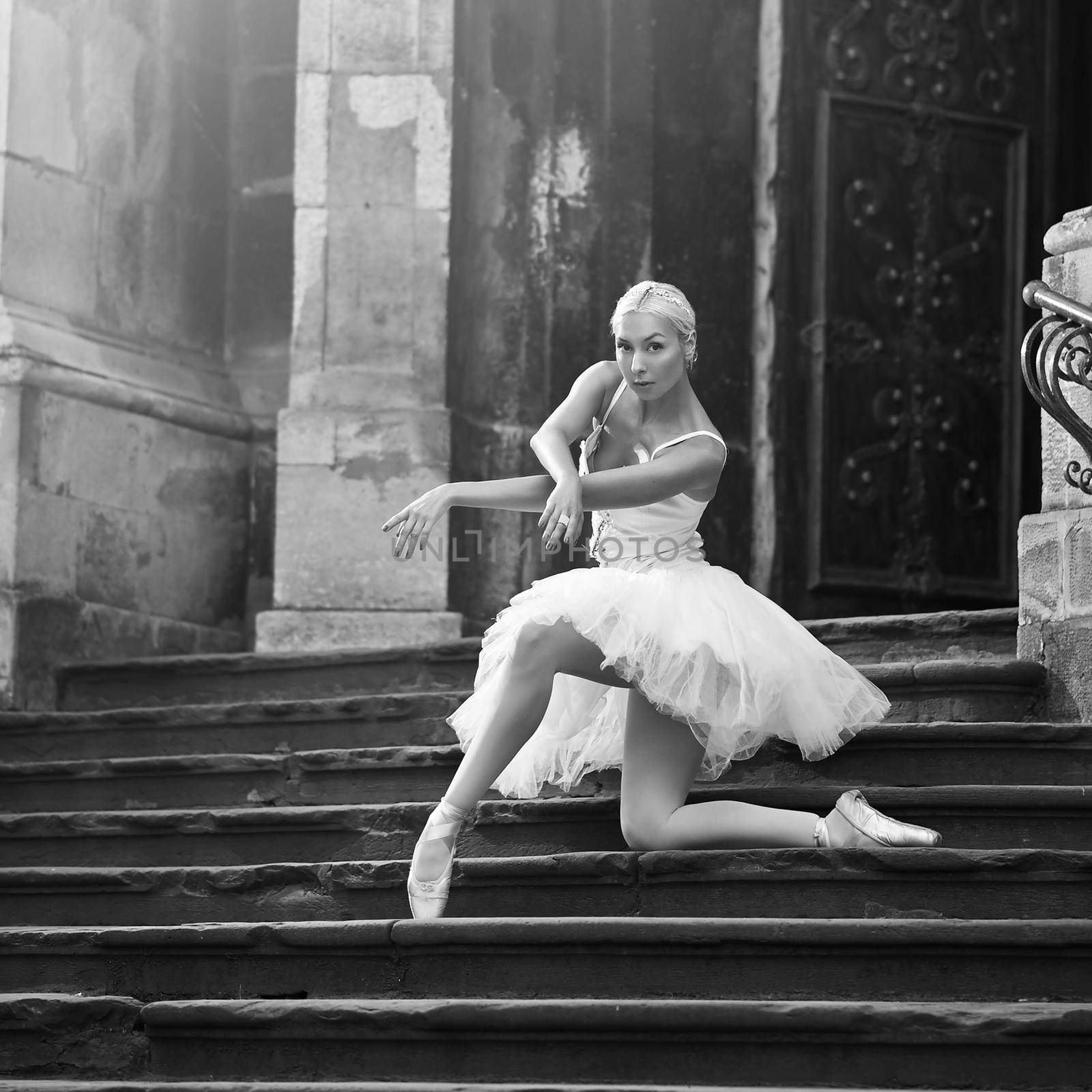Practicing everywhere. Outdoors monochrome soft focus shot of a ballerina dancing on a stairway