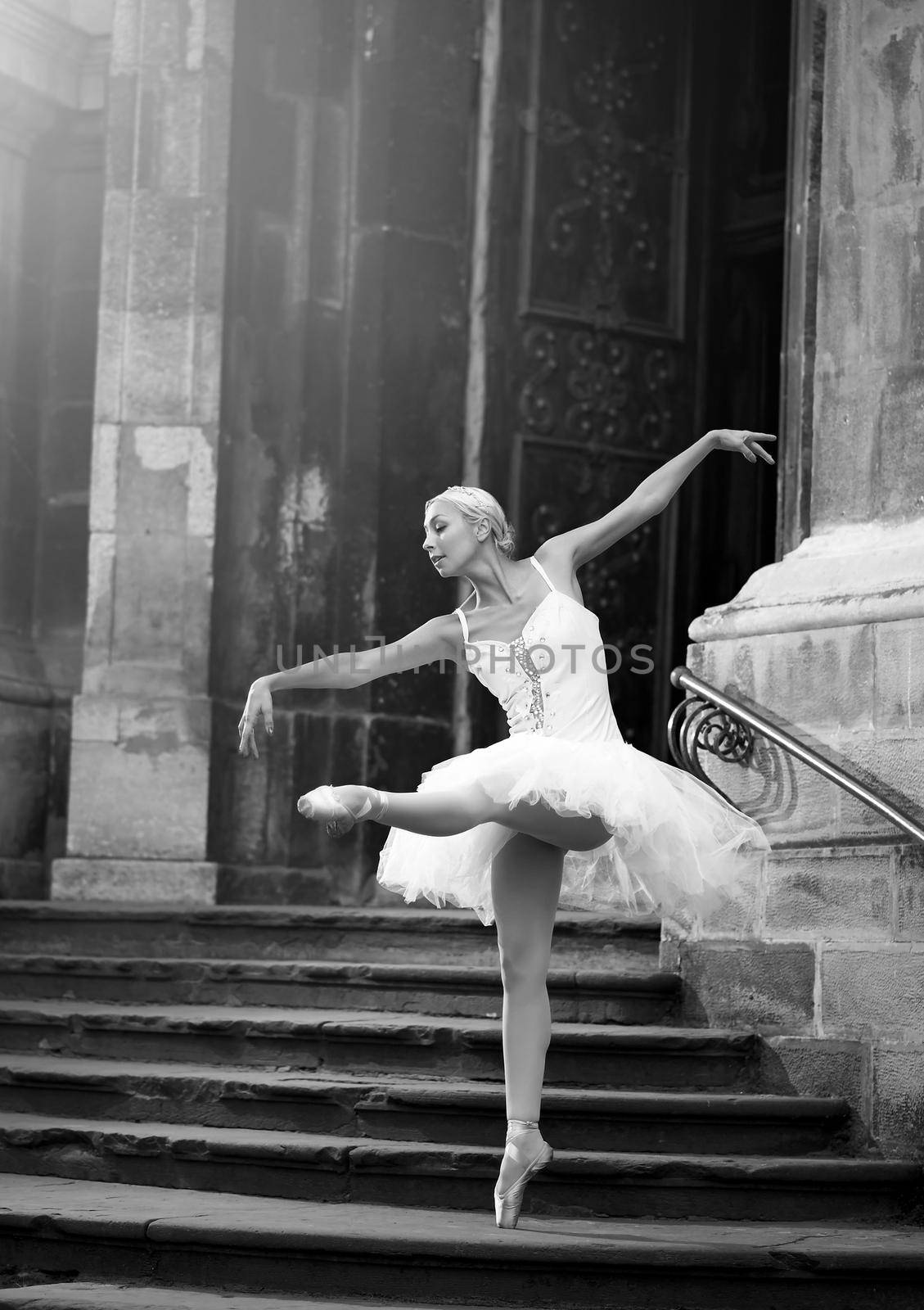 Young ballerina woman posing on stairs by SerhiiBobyk