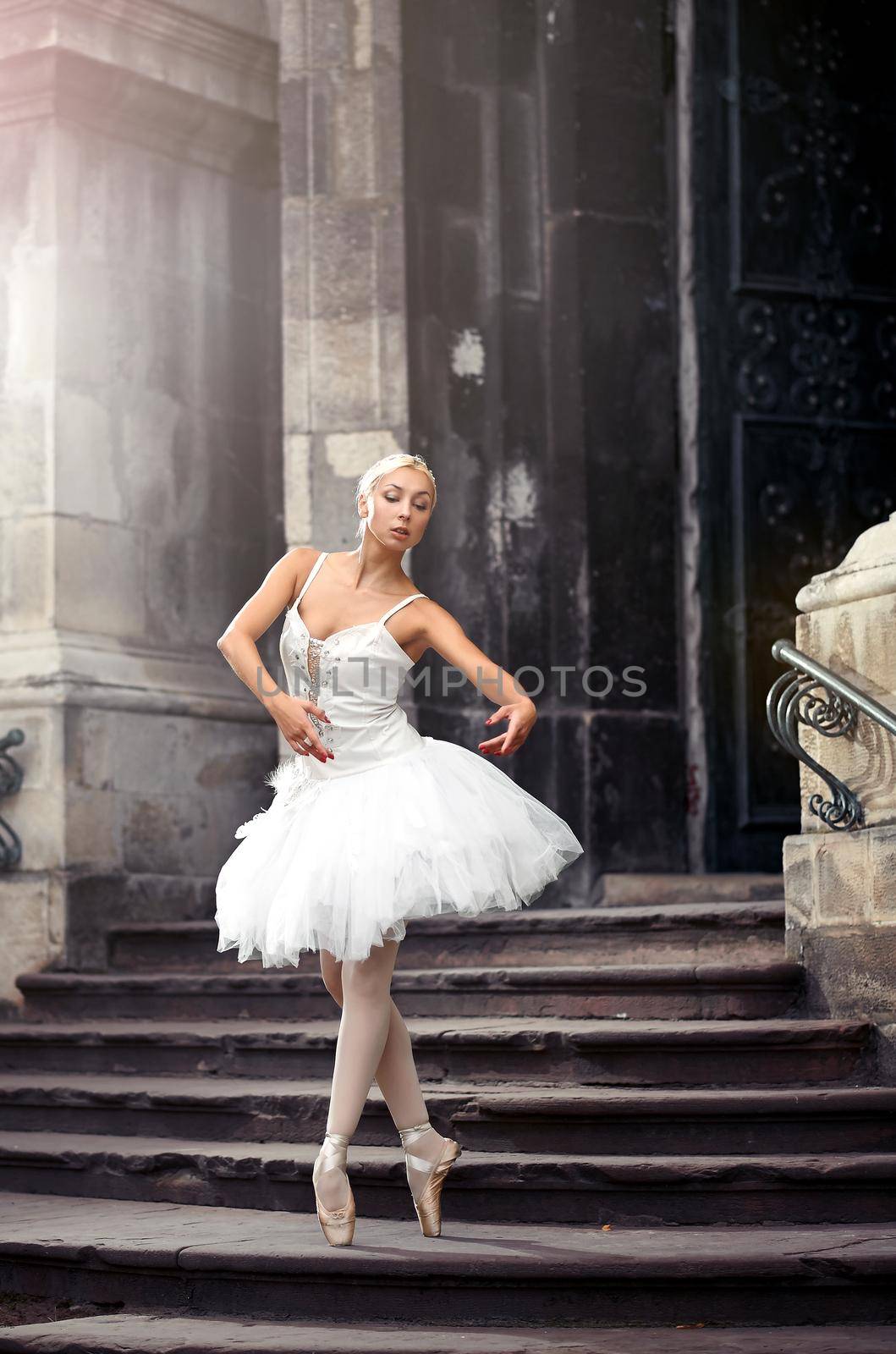 Motions of grace. Soft focus shot of a young female ballet dancer practicing on the stairway of an old building