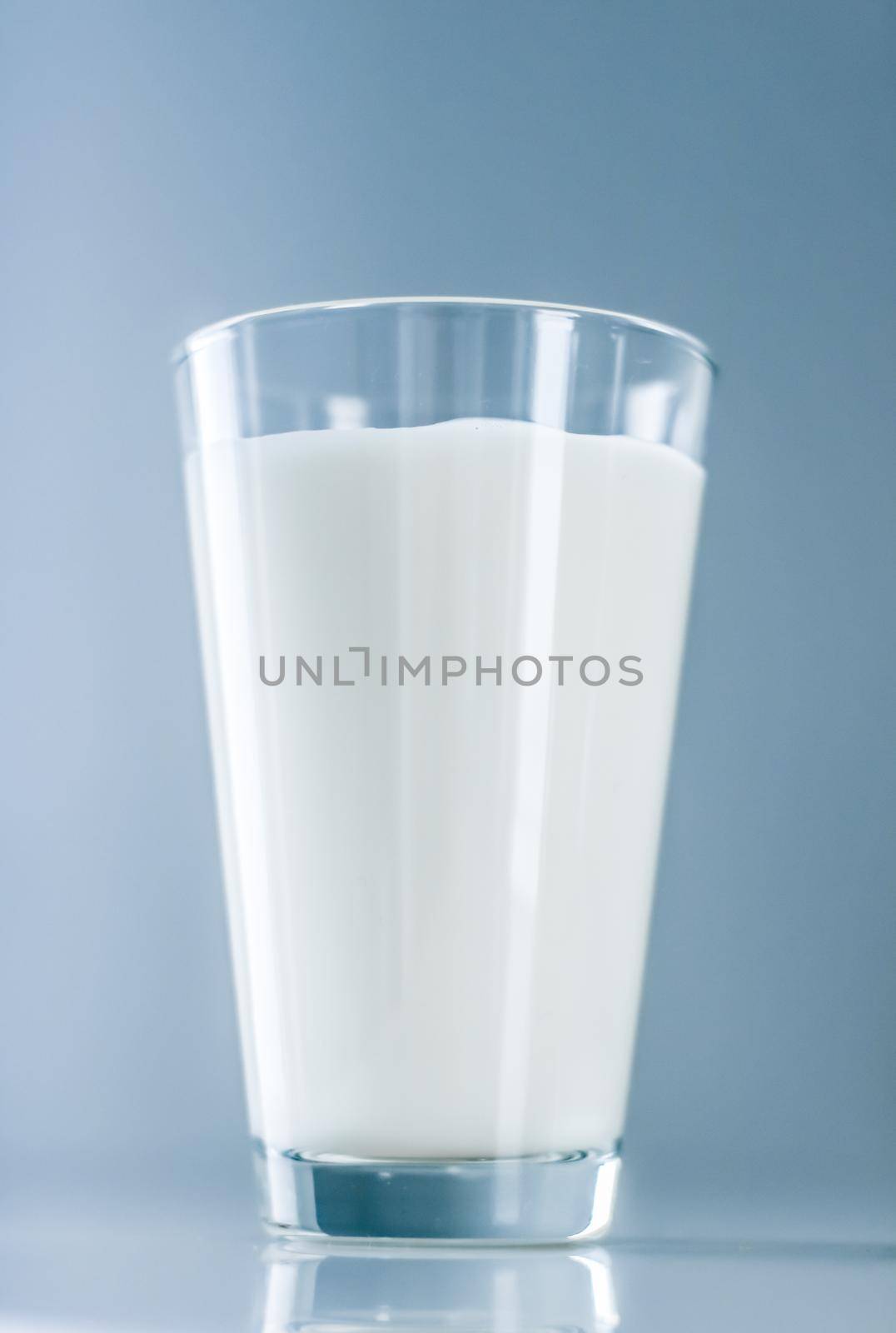 Dairy, healthy nutrition and breakfast concept - World Milk Day, full glass on marble table