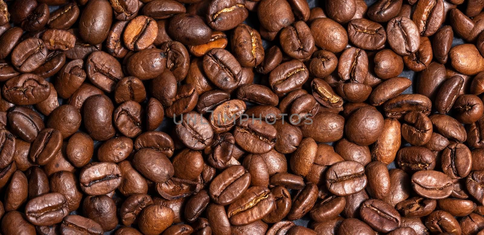 Fresh brown roasted coffee beans background