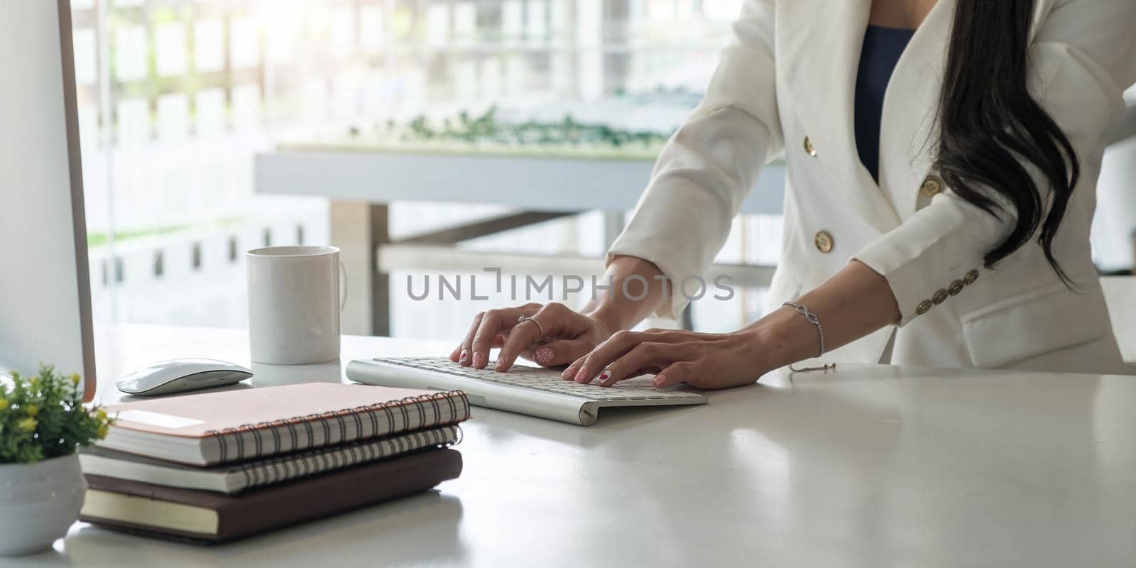 Close up of businesswoman or accountant working keyboard financial data report, accountancy document and laptop computer at office, business concept.