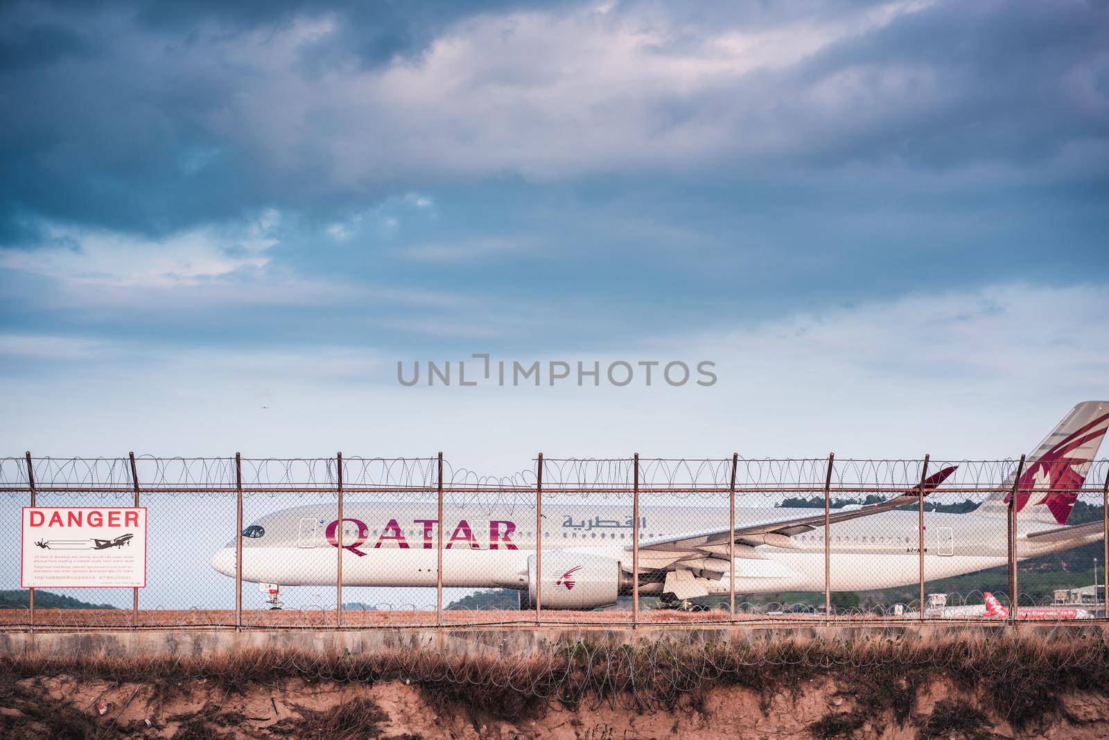 Phuket, Thailand - Feb 20, 2020: Qatar Airways Boeing 777 Airplane on Runway Track Preparation for Take-Off at Phuket International Airport. Business Transportation and Aviation Commercial Airliner