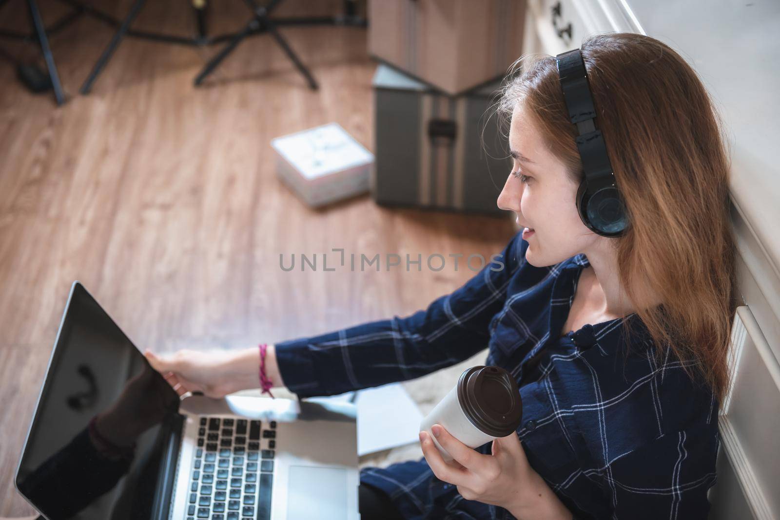 Young Woman Working on Computer Laptop at Home, Businesswoman in Happy Smiling While Online Virtual Conversation on Laptop From Home. Technology Communication and Creative Work at Home Concept