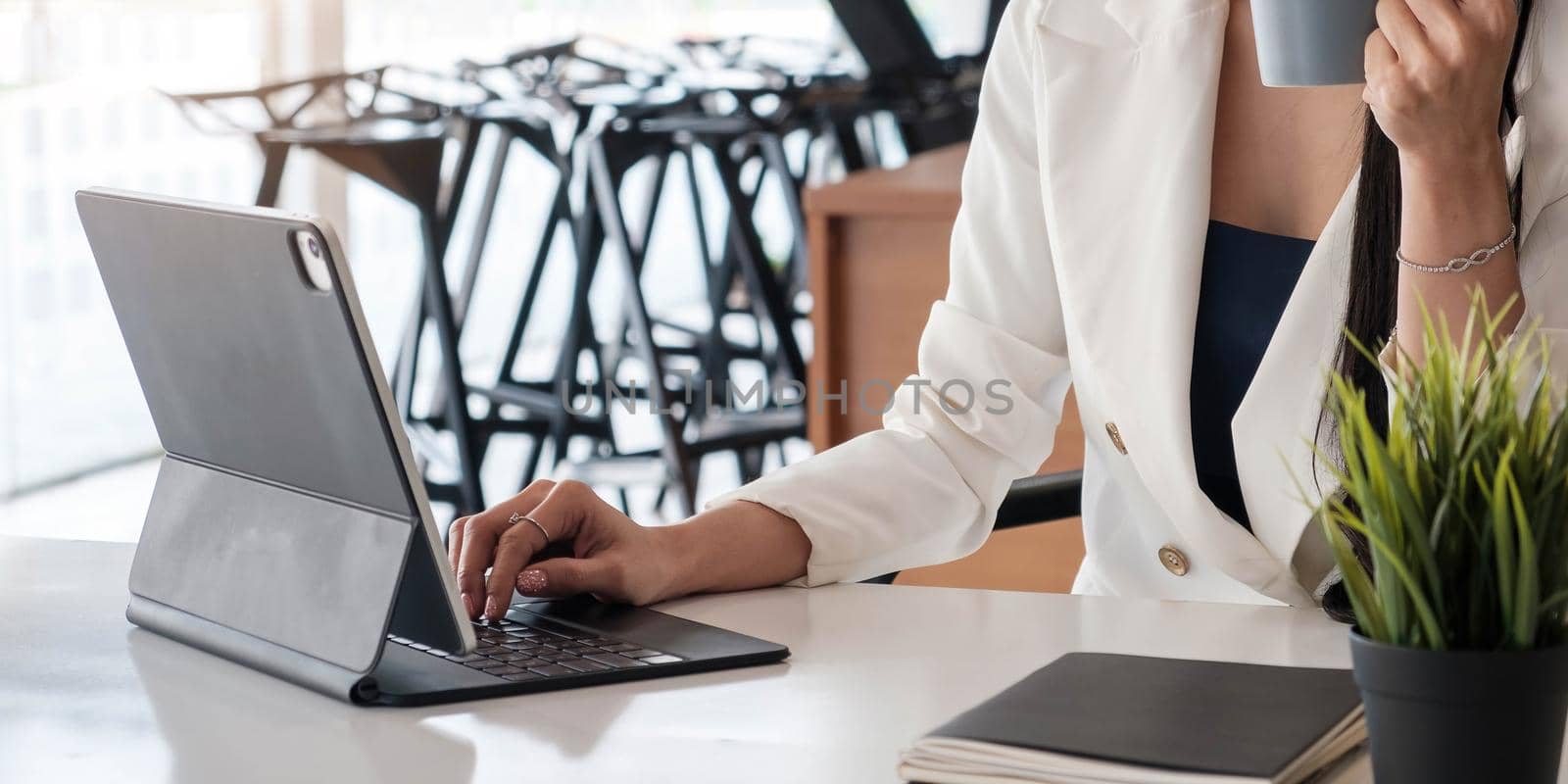 Close up of businesswoman or accountant working laptop financial data report, accountancy document and laptop computer at office, business concept