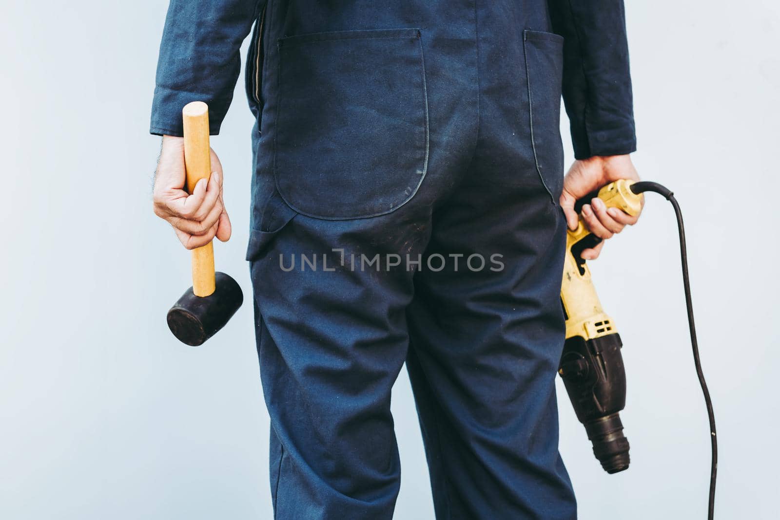 Construction Worker Holding Constructing Equipment Tools on Isolated Background. Carpenter Man Builder Real Estate Jobs Occupation, Business Engineering Industry and Building Development Concept.