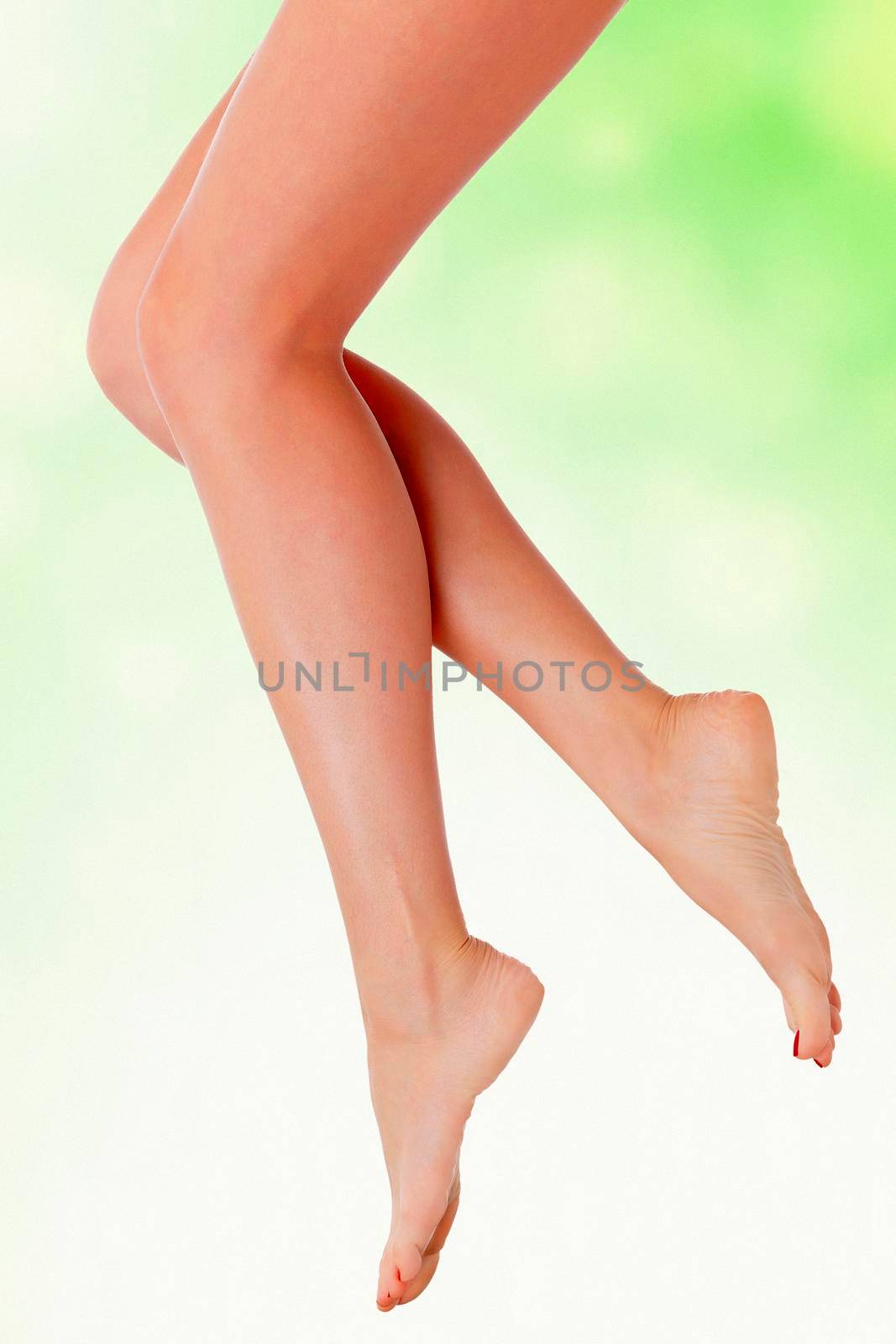 Legs in the air, green blurred background
