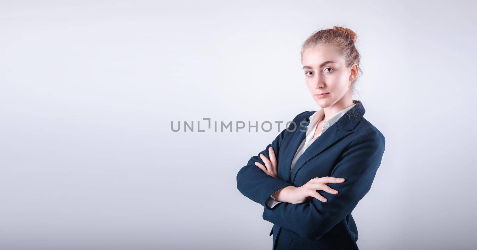 Portrait Attractive of Business Woman Executive Standing Against Isolated Background, Close-Up of Businesswoman in Formal Suit With Arms Crossed on Gray Backgrounds. Finance Employee Occupation