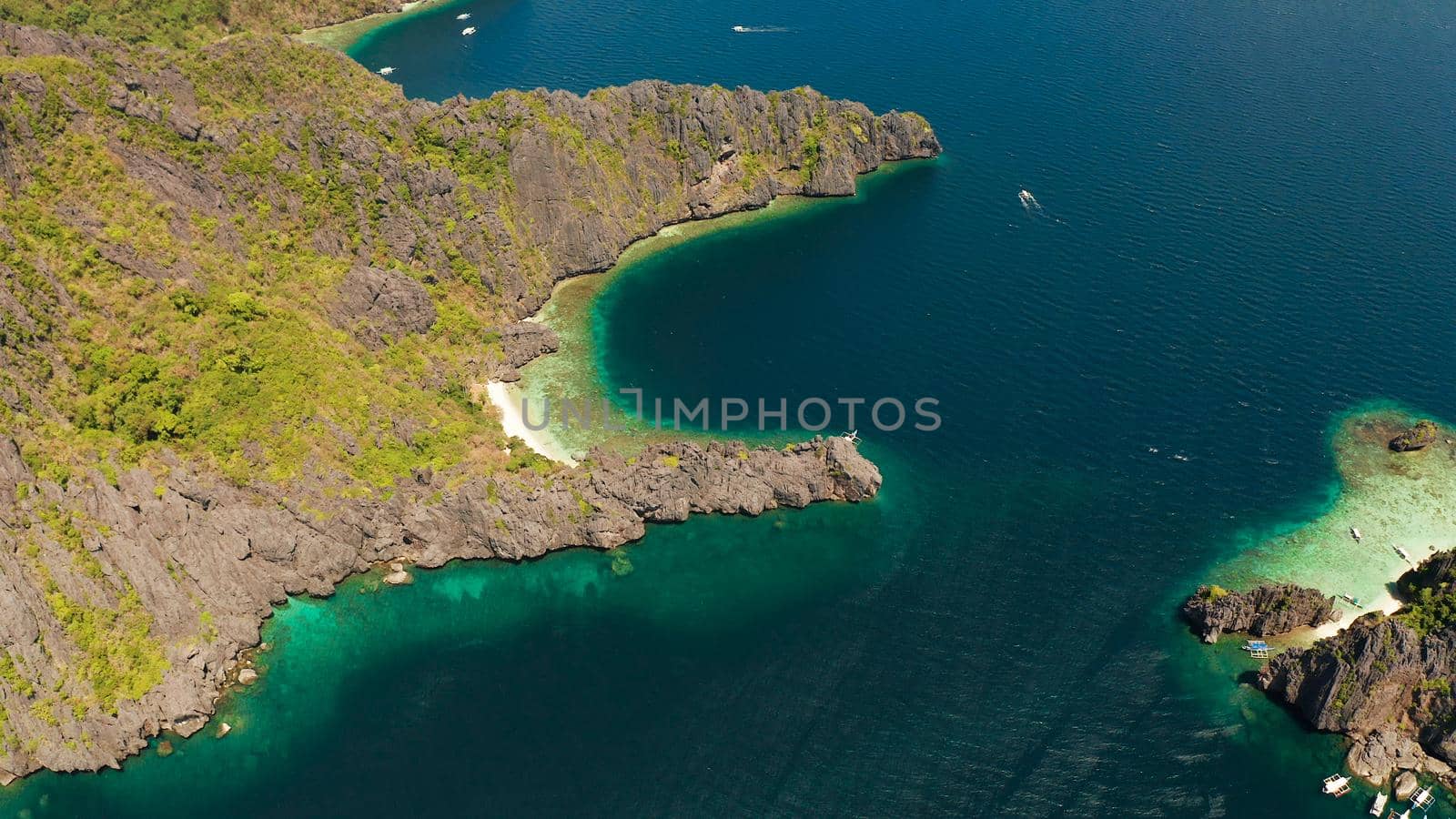 Tropical beach and clear blue water. El nido, Philippines, Palawan. Seascape with tropical rocky islands, ocean blue water. Summer and travel vacation concept