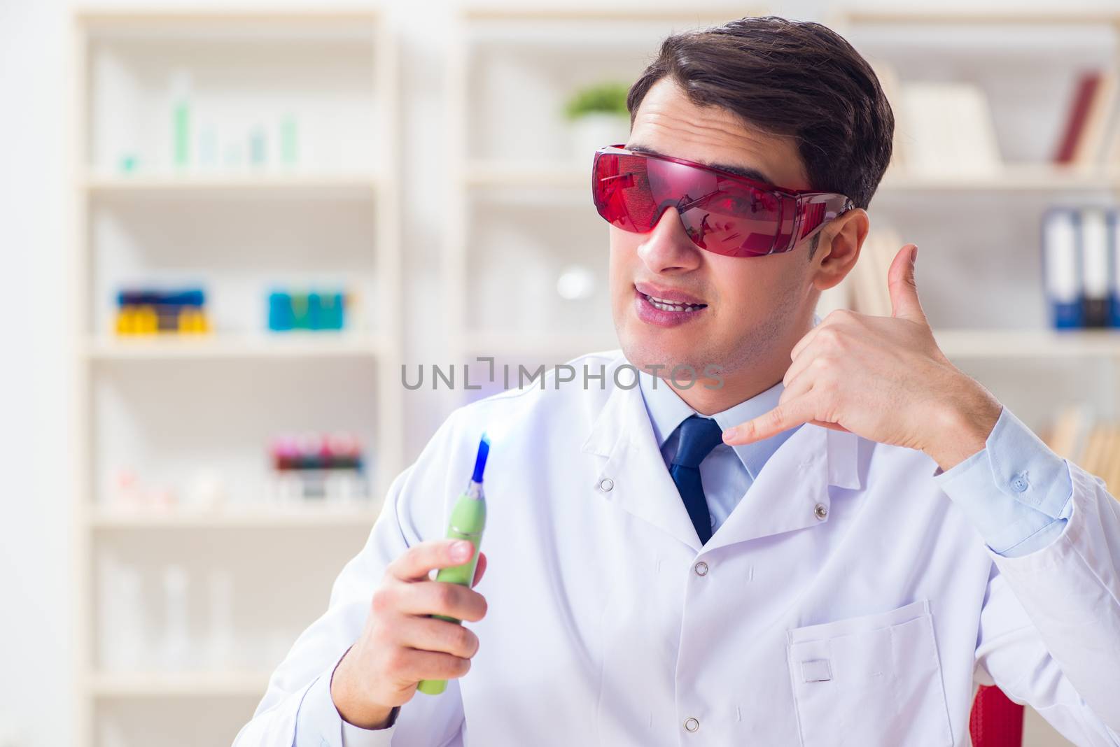 Young dentist working in the dentistry hospital by Elnur