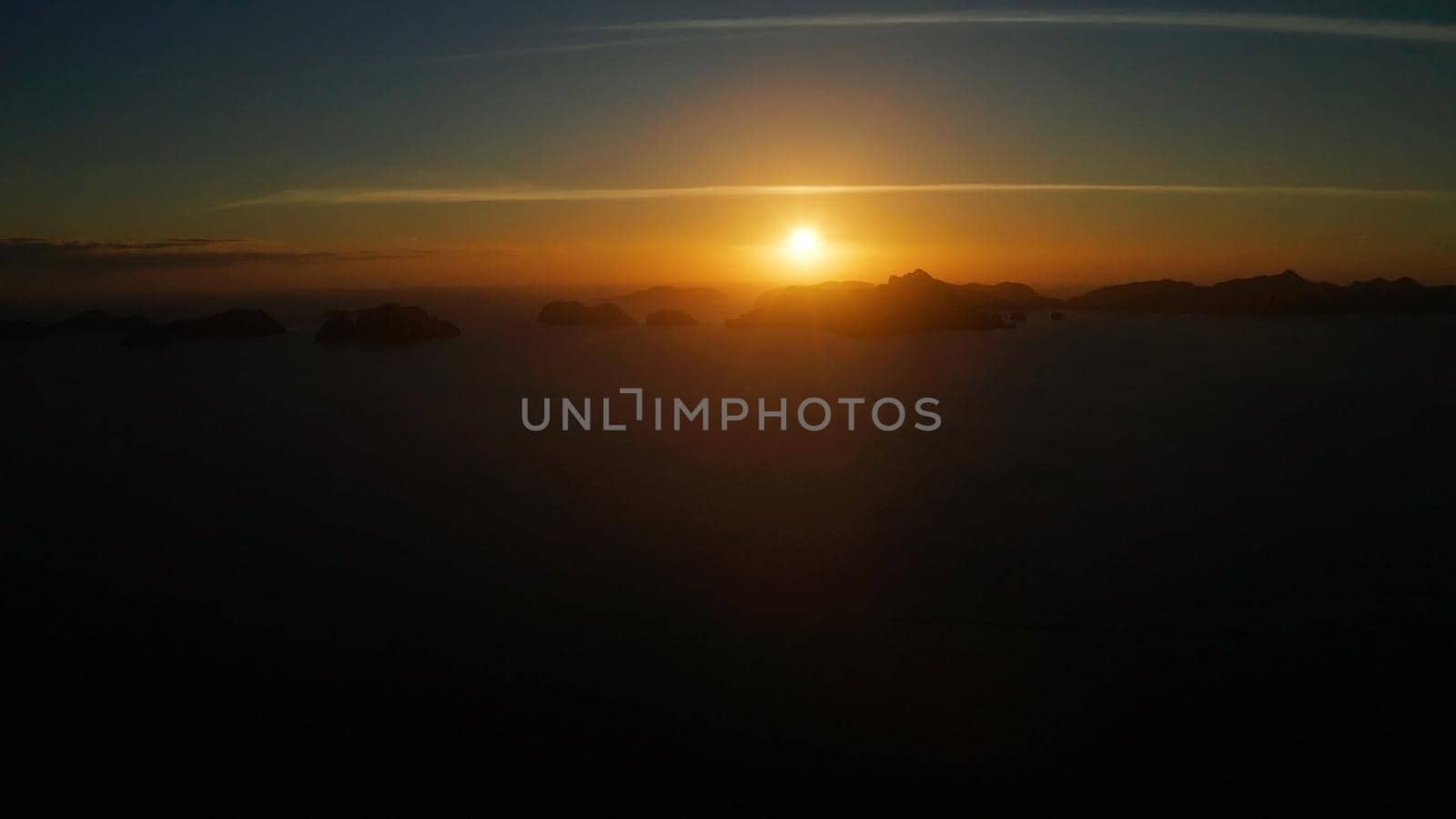 sunset over the sea background of mountains. El nido, Philippines, Palawan. seascape with tropical islands at sunset time. Summer and travel vacation concept