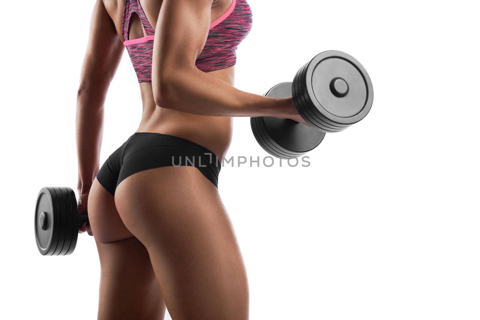 Cropped shot of a sexy fit and toned body of a young fitness woman in sportswear holding heavy dumbbells isolated on white copyspace.